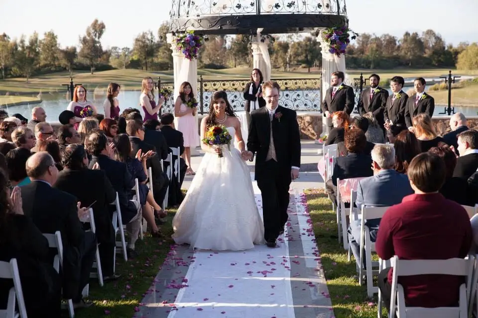 A smiling newlywed couple recesses away from their Star Wars wedding ceremony with offbeat wedding officiant Let's Get Married by Marie