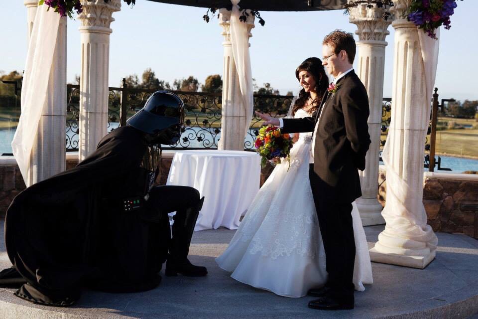 Darth Vader bows to the Imperial newlyweds after their Star Wars wedding ceremony