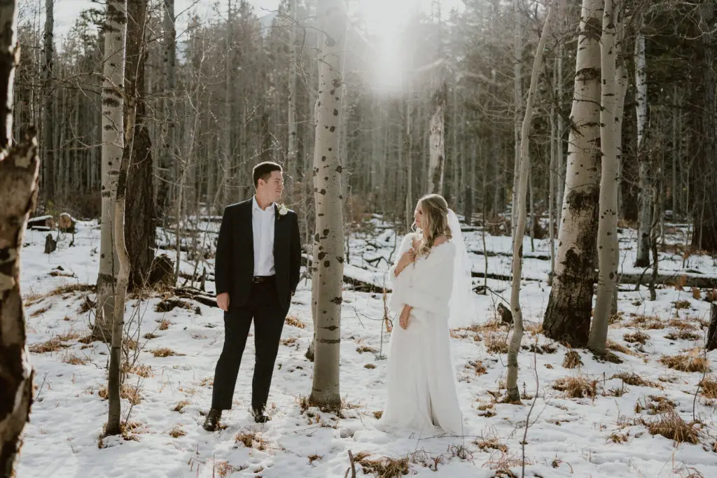 a bride and groom in a grove of trees during their Tahoe elopement package with Let's Get Married by Marie