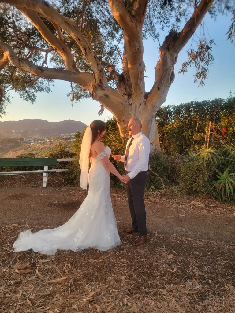 A bride and groom say their vows during a short and sweet elopement with Let's Get Married by Marie