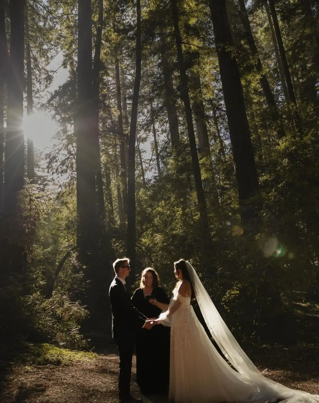 Let's Get Married by Marie performs a Redwoods elopement ceremony for a bride and groom as the sun streams down on them through the trees